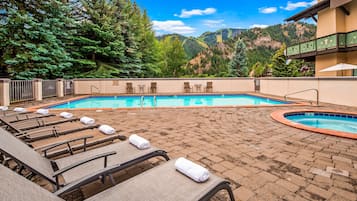 Outdoor pool, open 9 AM to 10 PM, pool umbrellas, sun loungers