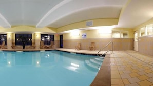 A large indoor swimming pool with clear water, surrounded by lounge chairs and a tiled floor. - Holiday Inn Express Hotel & Suites Harriman by IHG (Harriman)