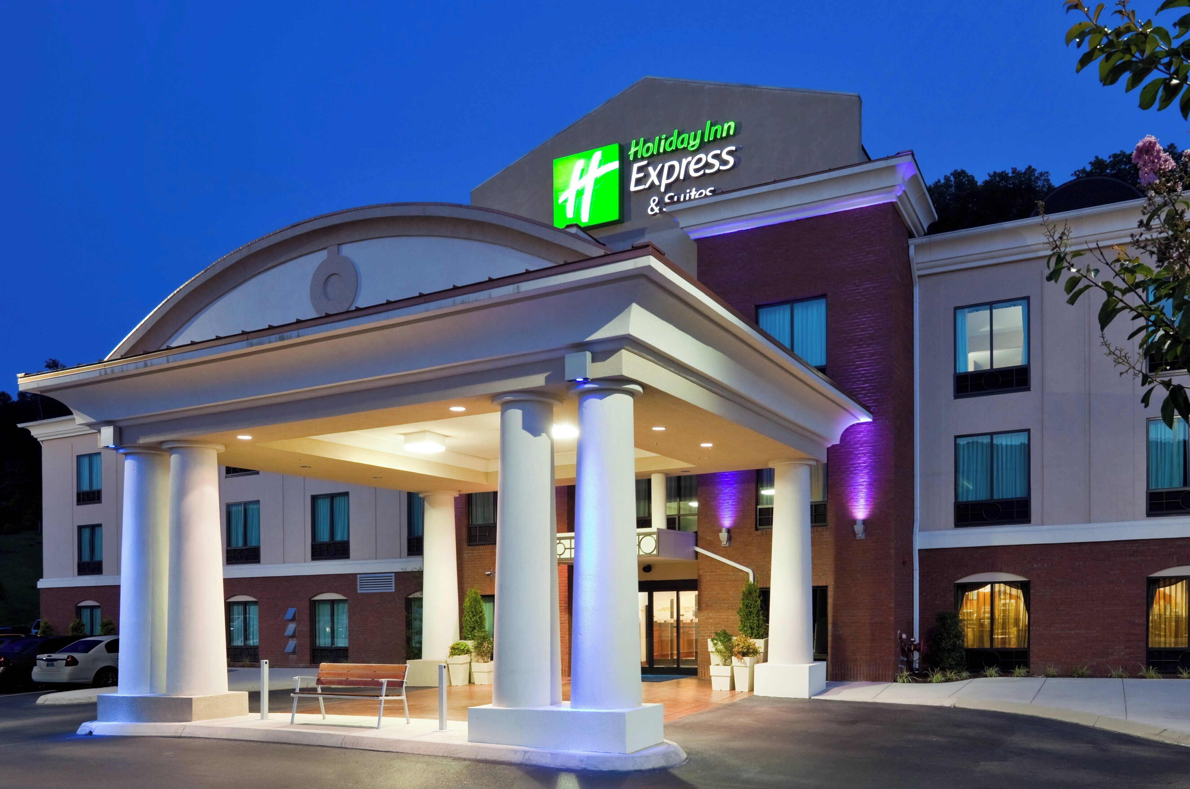 A Holiday Inn Express hotel with a covered entrance, columns, and a brick facade.