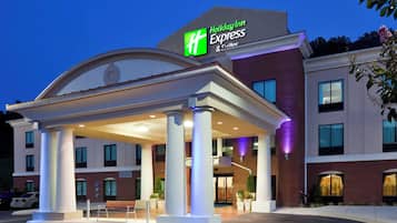 A Holiday Inn Express hotel with a covered entrance, columns, and a brick facade.