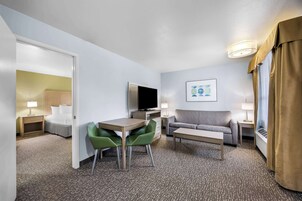 Suite, 1 King Bed, Non Smoking, Jetted Tub | Blackout drapes, iron/ironing board, free WiFi, bed sheets