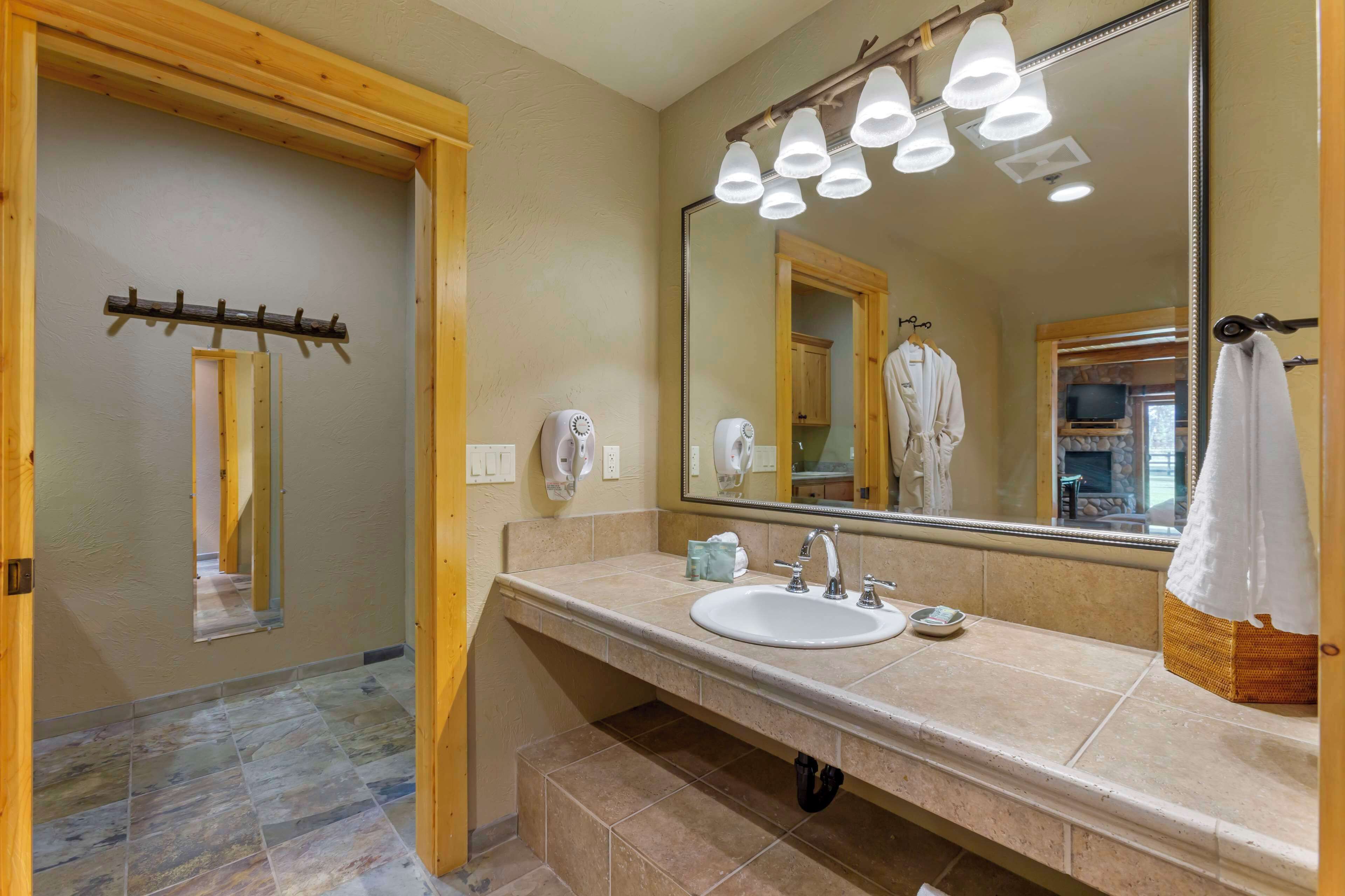 suite, 1 king bed, non smoking, jetted tub (with sofabed;no pets in room type) | bathroom | free toiletries, hair dryer, towels, soap