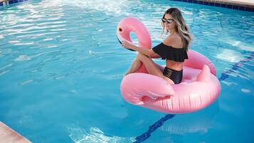 Outdoor pool, open 10:00 AM to 10:00 PM, pool umbrellas, pool loungers