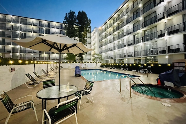Outdoor pool, open 10:00 AM to 10:00 PM, pool umbrellas, sun loungers
