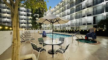 Outdoor pool, open 10:00 AM to 10:00 PM, pool umbrellas, pool loungers