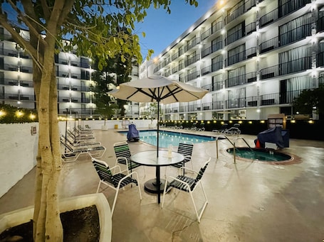 Outdoor pool, open 10:00 AM to 10:00 PM, pool umbrellas, sun loungers