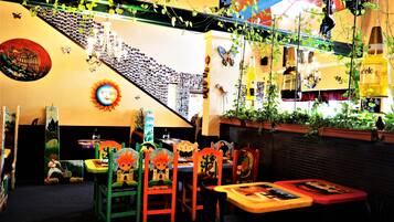 Enjoy a vibrant atmosphere with a variety of seating options and unique decor.