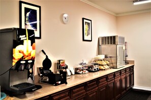 A kitchenette with a coffee machine, toaster, and refrigerator. - GuestHouse Enumclaw (Enumclaw)