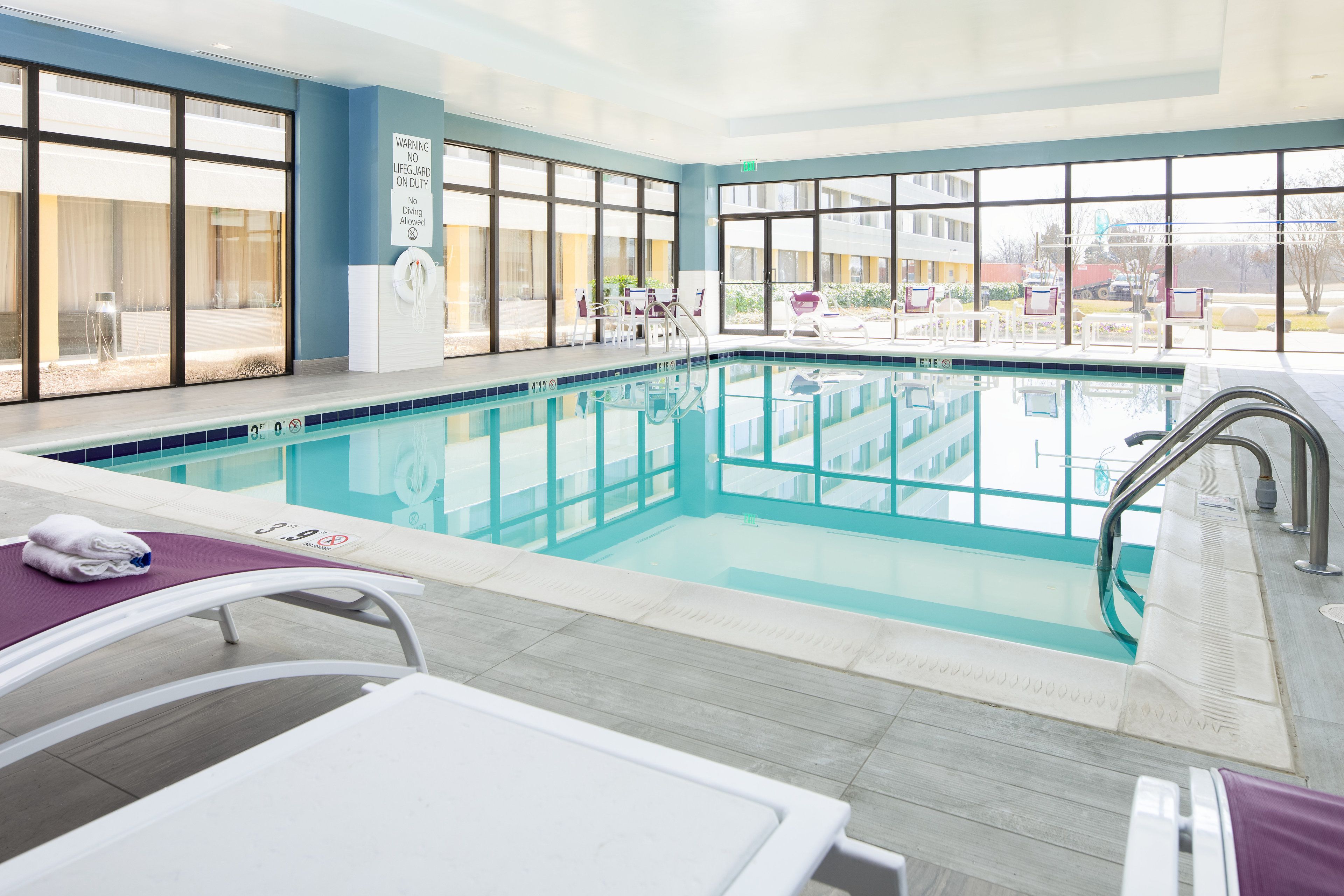 Indoor pool, open 8:00 AM to 9:00 PM, pool loungers