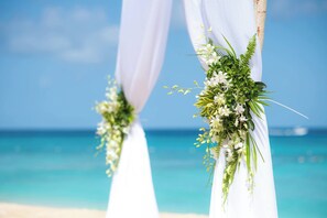 On the beach, white sand, sun-loungers, beach umbrellas