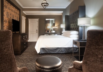 Premium bedding, pillowtop beds, in-room safe, blackout drapes at Le Pavillon New Orleans