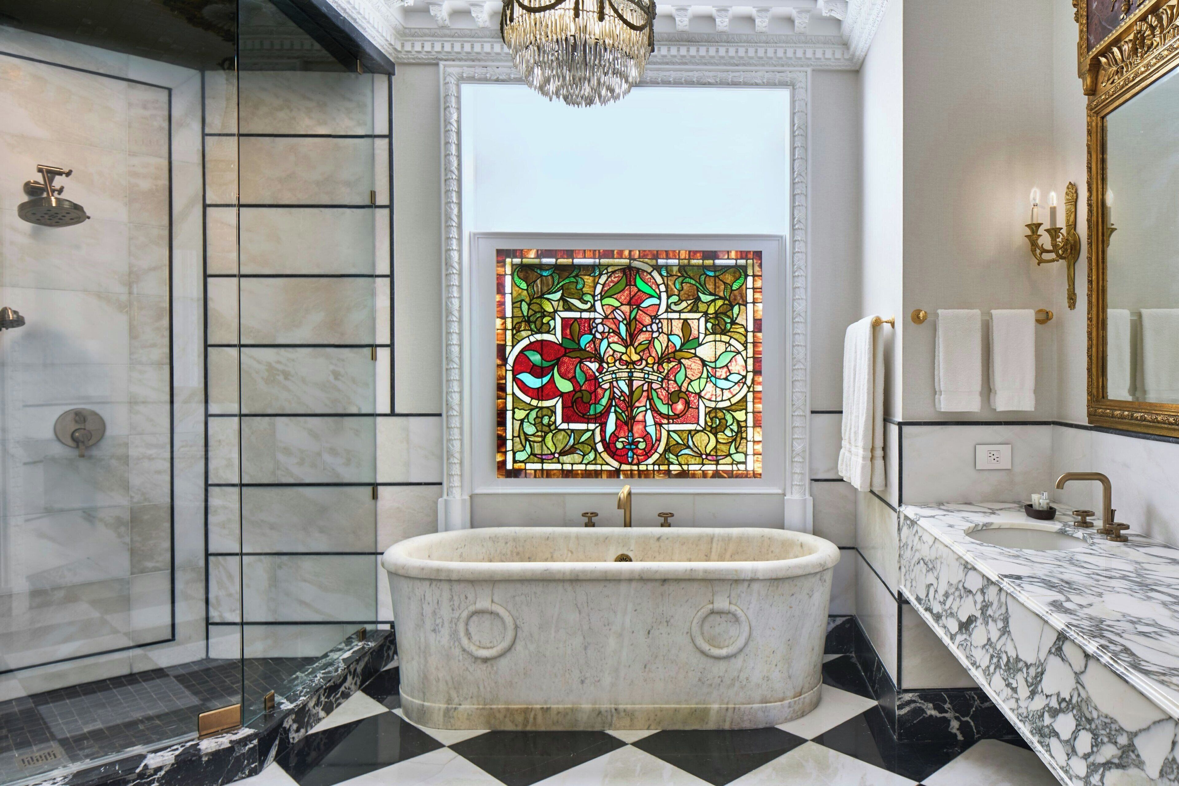 combined shower/bathtub, designer toiletries, hair dryer, towels