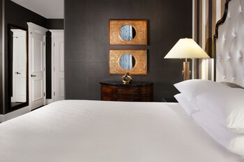 Premium bedding, pillowtop beds, in-room safe, blackout drapes at Le Pavillon New Orleans