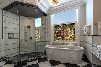Combined shower/tub, designer toiletries, hair dryer, towels at Le Pavillon New Orleans