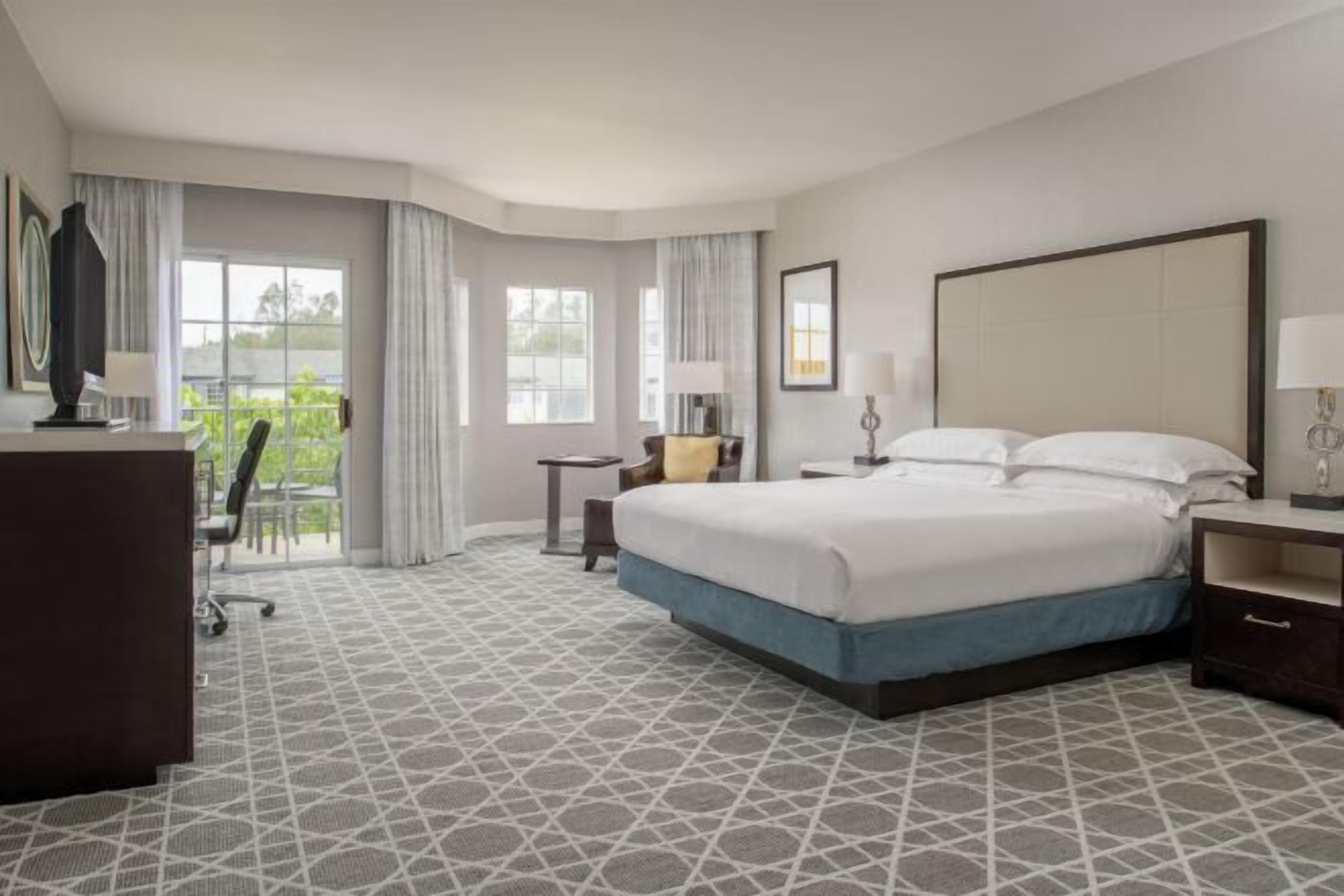 Premium bedding, down comforters, in-room safe, desk