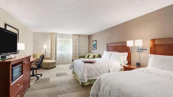 Hypo-allergenic bedding, desk, laptop workspace, blackout drapes
