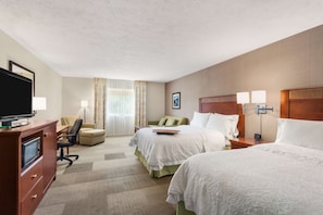 Hypo-allergenic bedding, desk, laptop workspace, blackout drapes