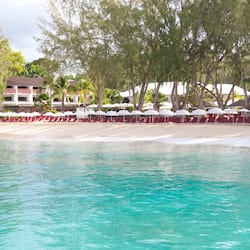 On the beach, white sand, sun loungers, beach umbrellas