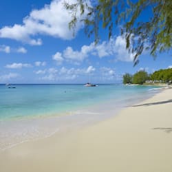 On the beach, white sand, sun loungers, beach umbrellas