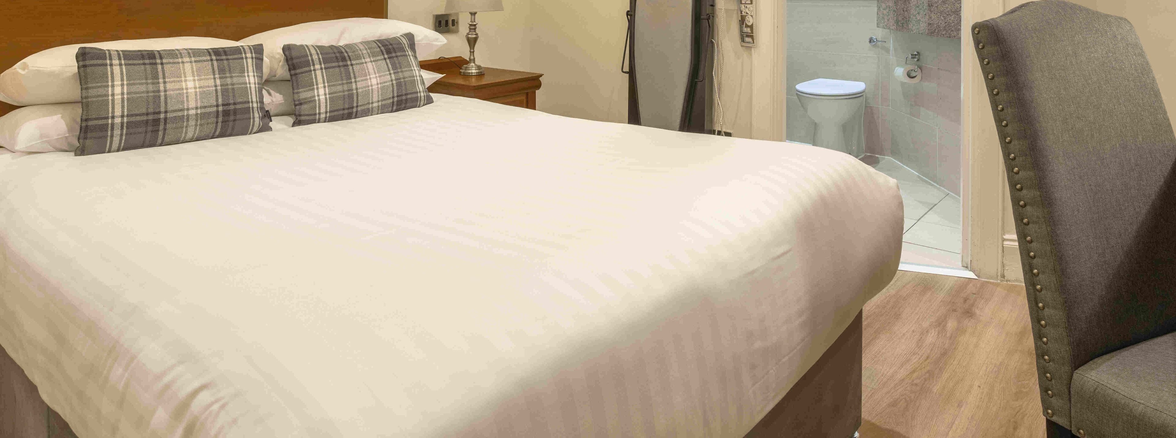 junior double room, 1 double bed, non smoking, no windows | desk, iron/ironing board, free wifi, bed sheets