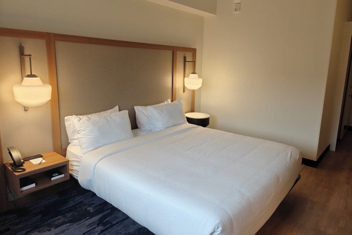 Desk, laptop workspace, blackout drapes, iron/ironing board