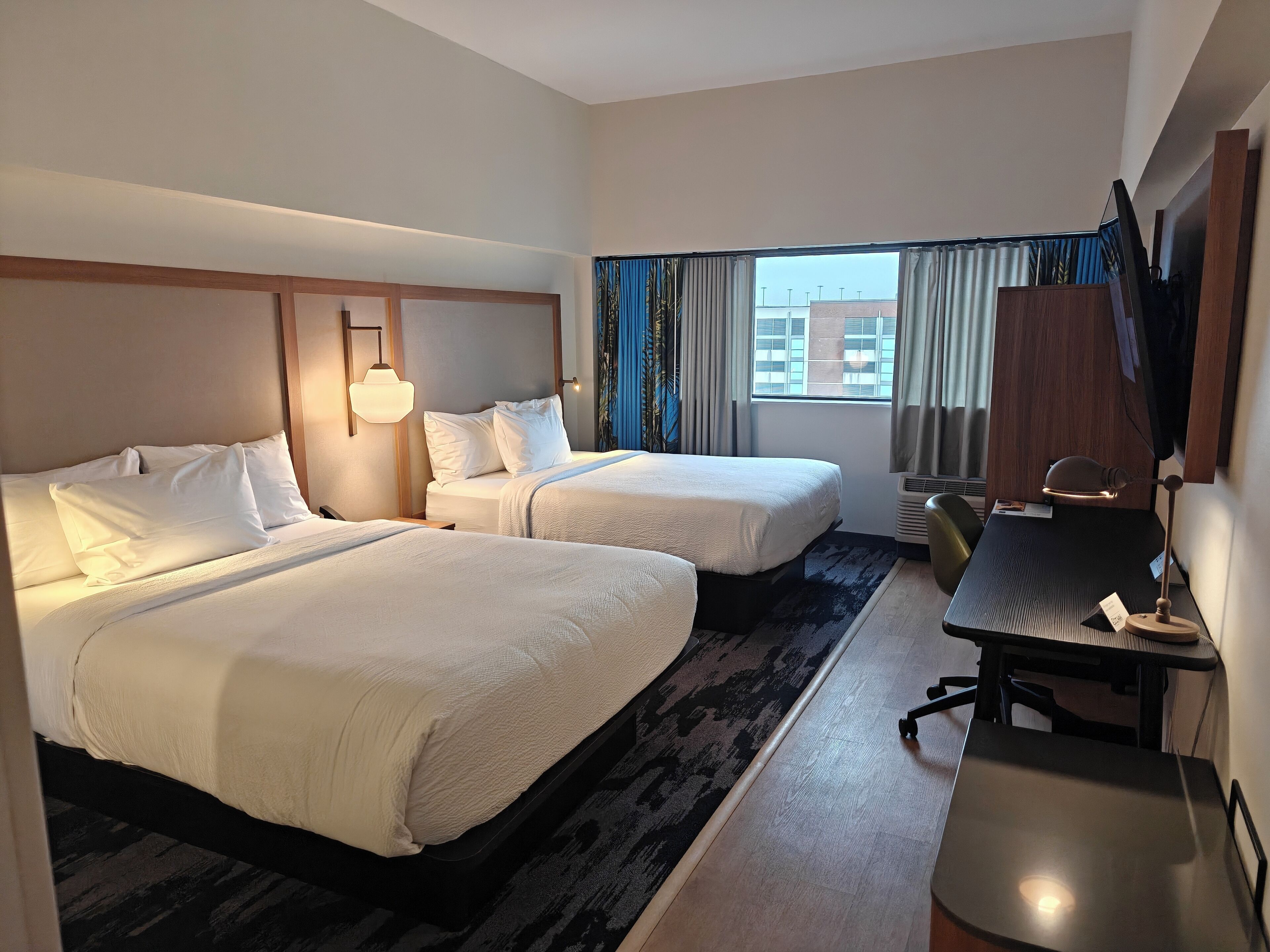 Desk, laptop workspace, blackout drapes, iron/ironing board