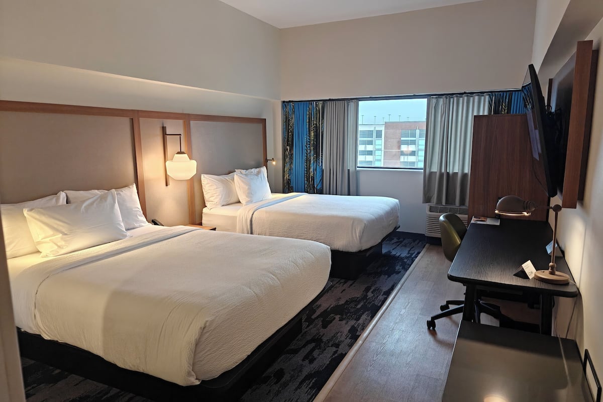 Desk, laptop workspace, blackout drapes, iron/ironing board