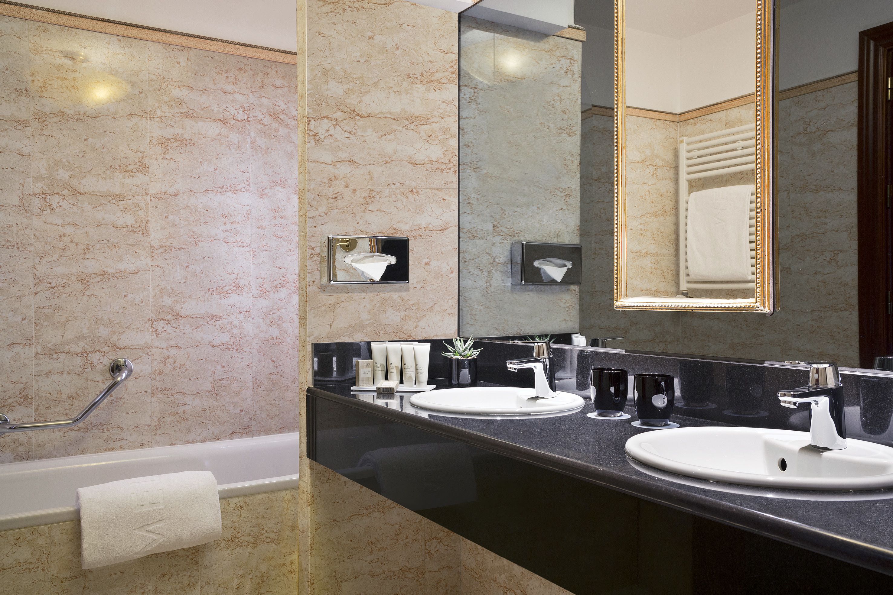 junior suite | bathroom | deep-soaking bathtub, eco-friendly toiletries, hair dryer, towels