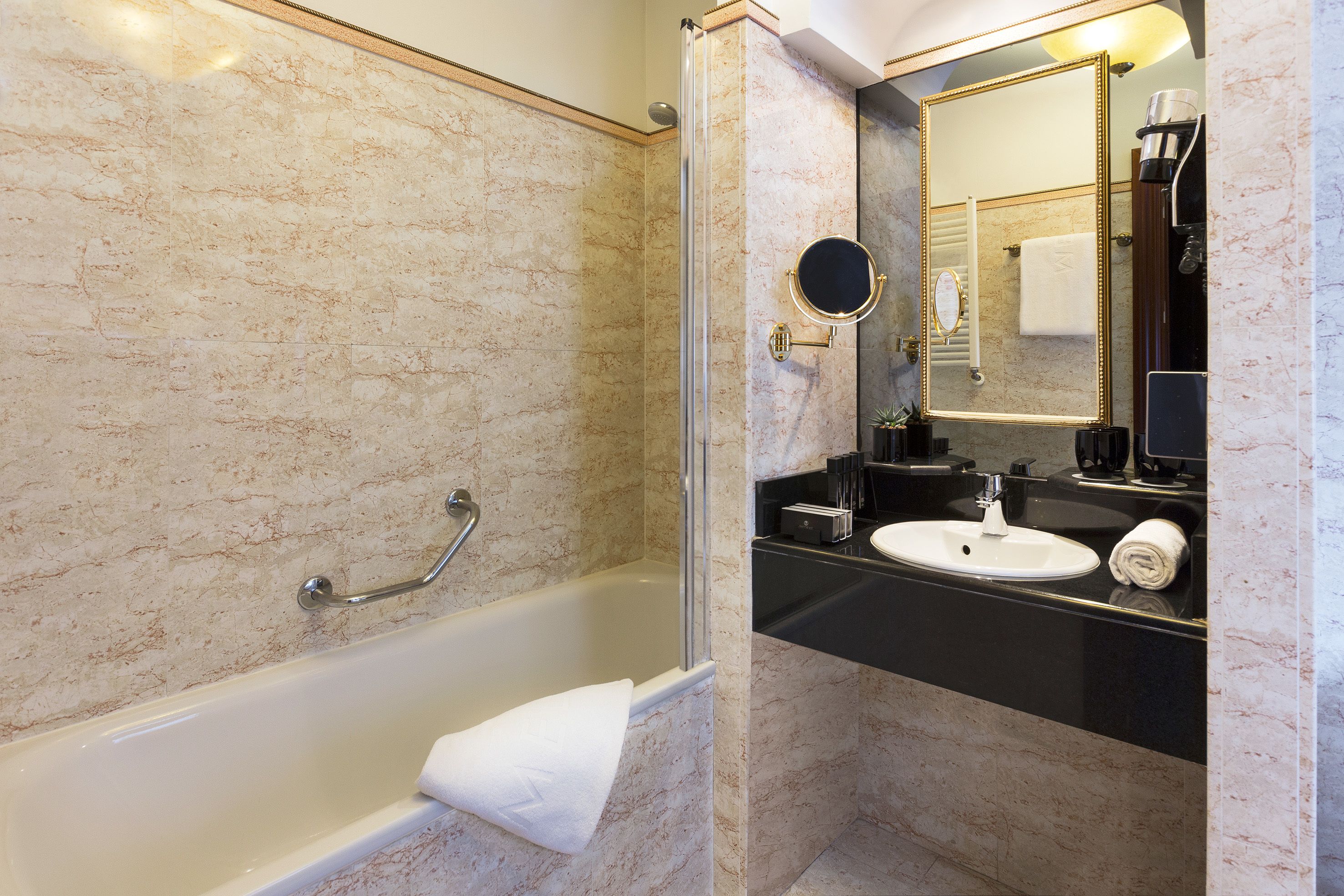 deep-soaking bathtub, eco-friendly toiletries, hair dryer, towels