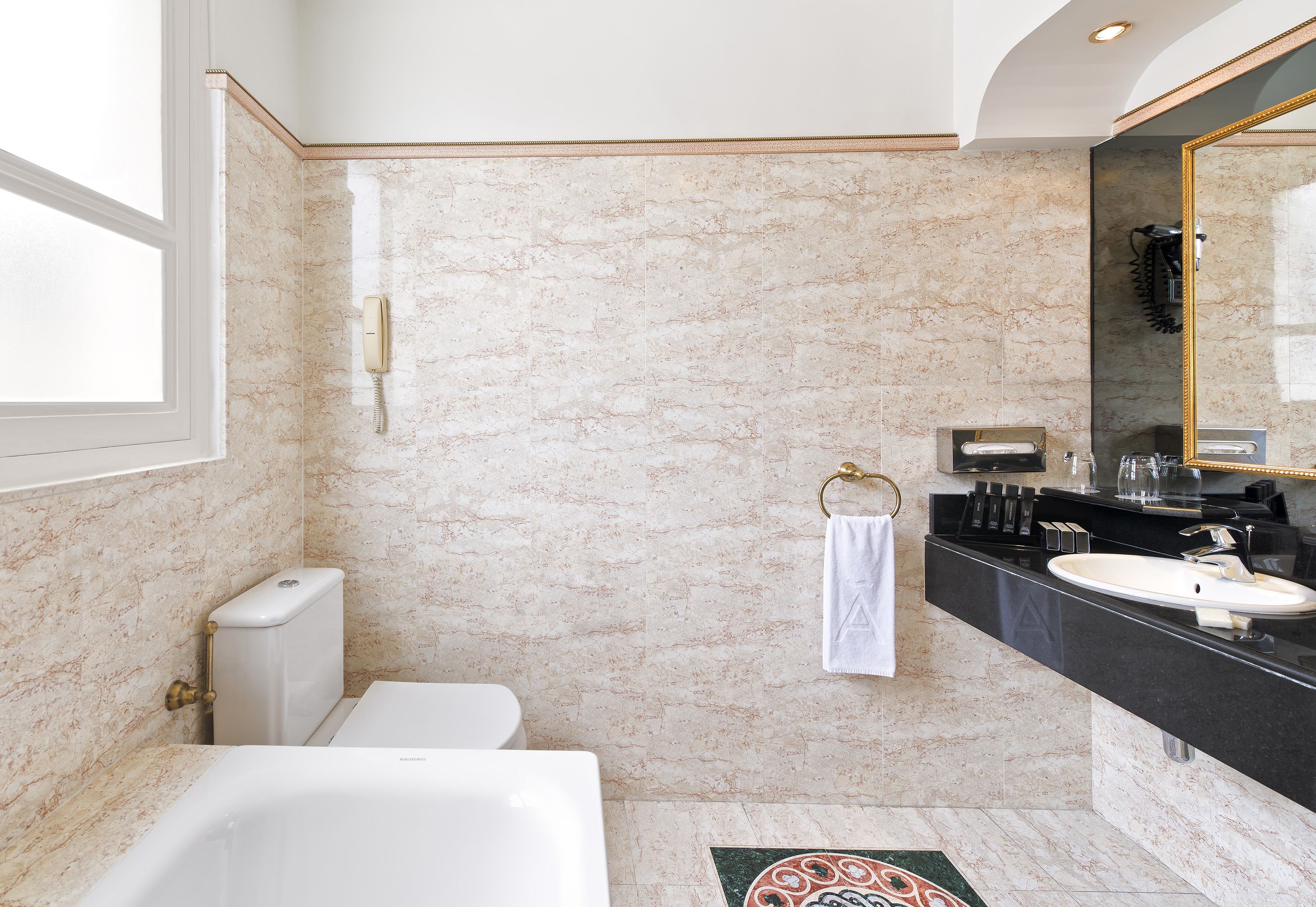 deep-soaking bathtub, eco-friendly toiletries, hair dryer, towels