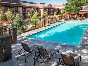 Seasonal outdoor pool, open 9:00 AM to 9:00 PM, pool umbrellas
