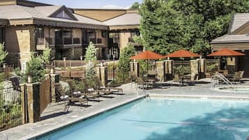 Seasonal outdoor pool, open 9:00 AM to 9:00 PM, pool umbrellas