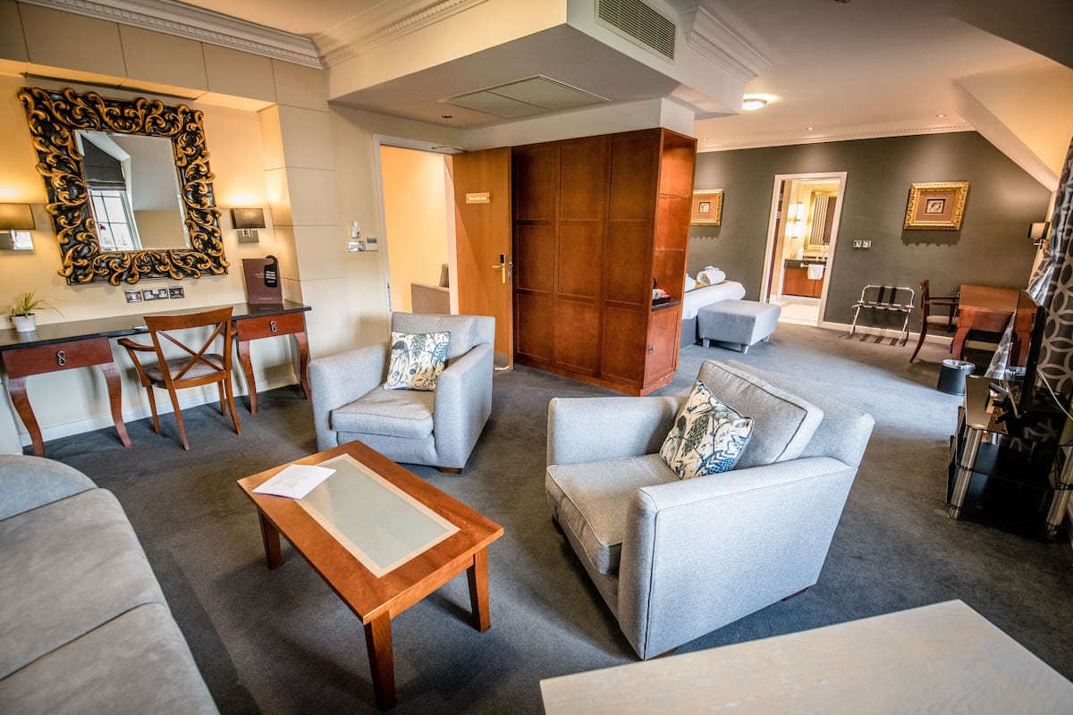 suite, 1 king bed with sofa bed, non smoking, balcony | 1 bedroom, desk, blackout curtains, iron/ironing board