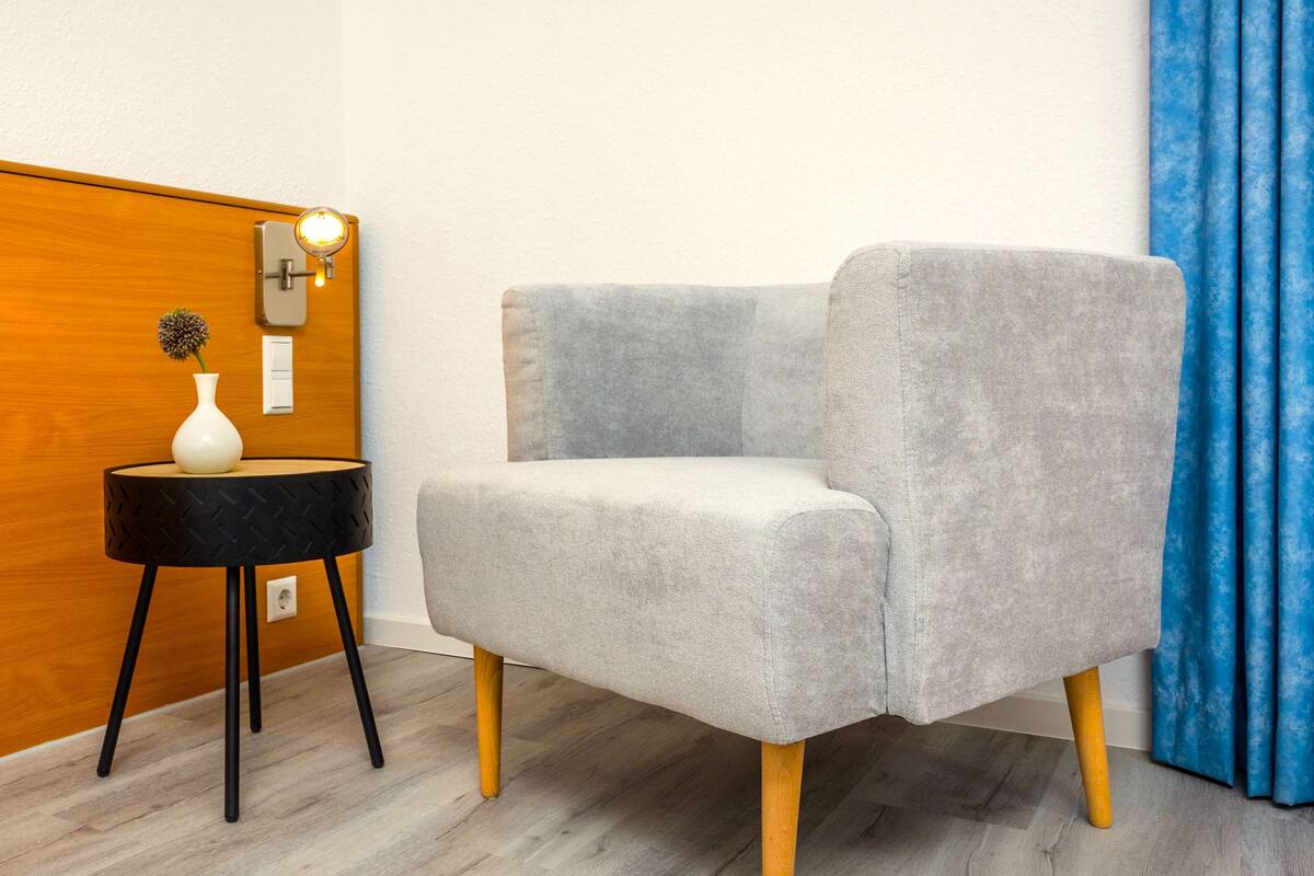 hypo-allergenic bedding, desk, laptop workspace, blackout curtains