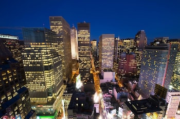 Hotel room view looking out at Crowne Plaza Times Square Manhattan, an IHG Hotel