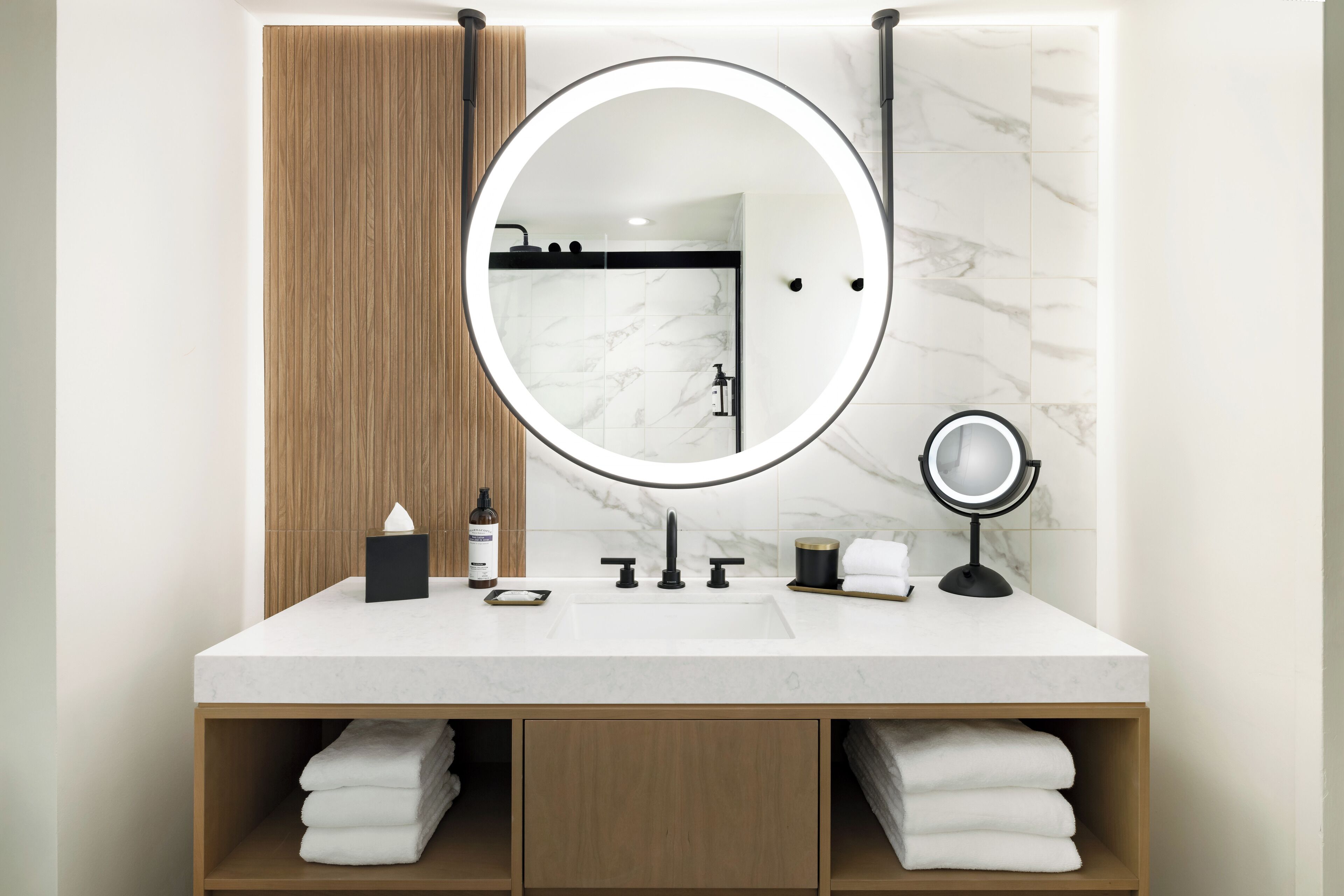 designer toiletries, hair dryer, towels, soap