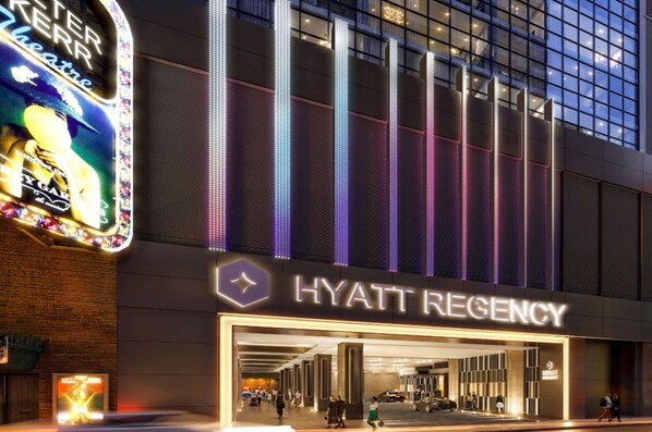 Welcome to the Hyatt Regency, featuring a modern architectural design with a prominent entrance and contemporary lighting.