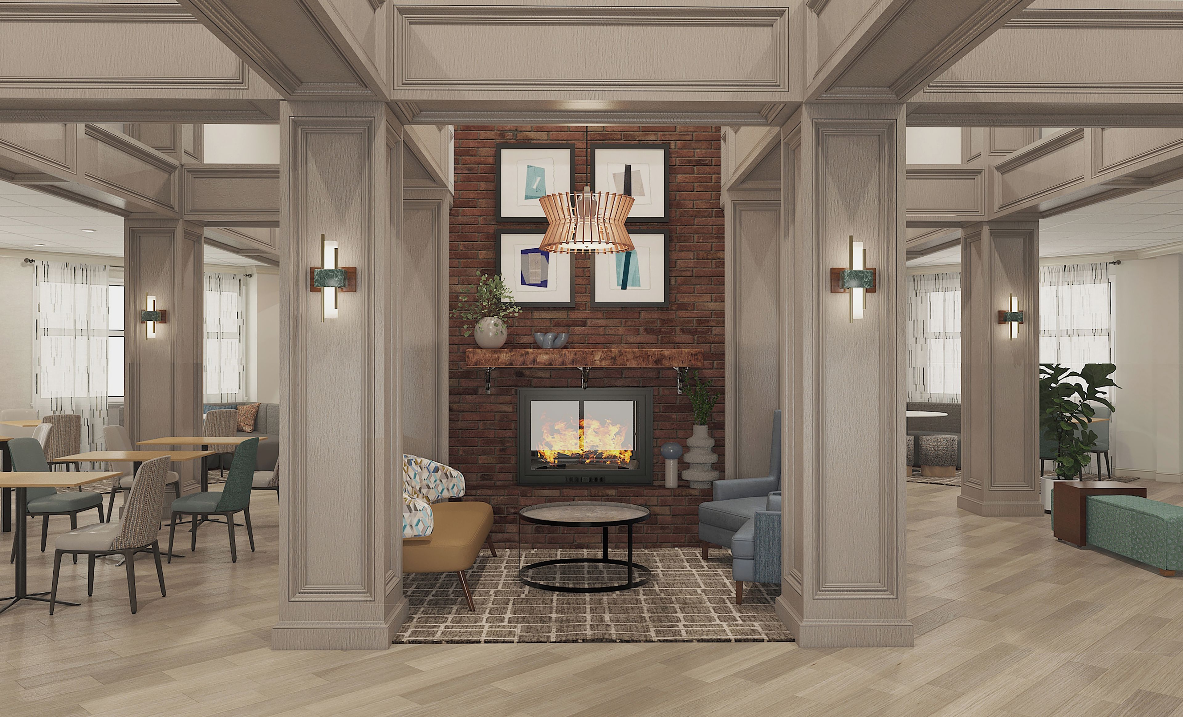 A spacious lobby with a fireplace, seating area, and a coffee table.