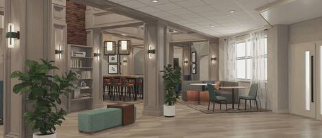 A spacious living area with a fireplace, a dining area, and a kitchen in the background.