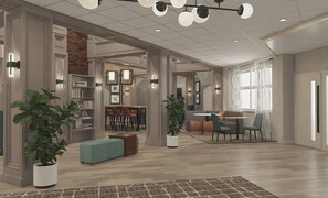 A spacious living area with a fireplace, a dining area, and a kitchen in the background. - Hyatt Select Pigeon Forge (Pigeon Forge)