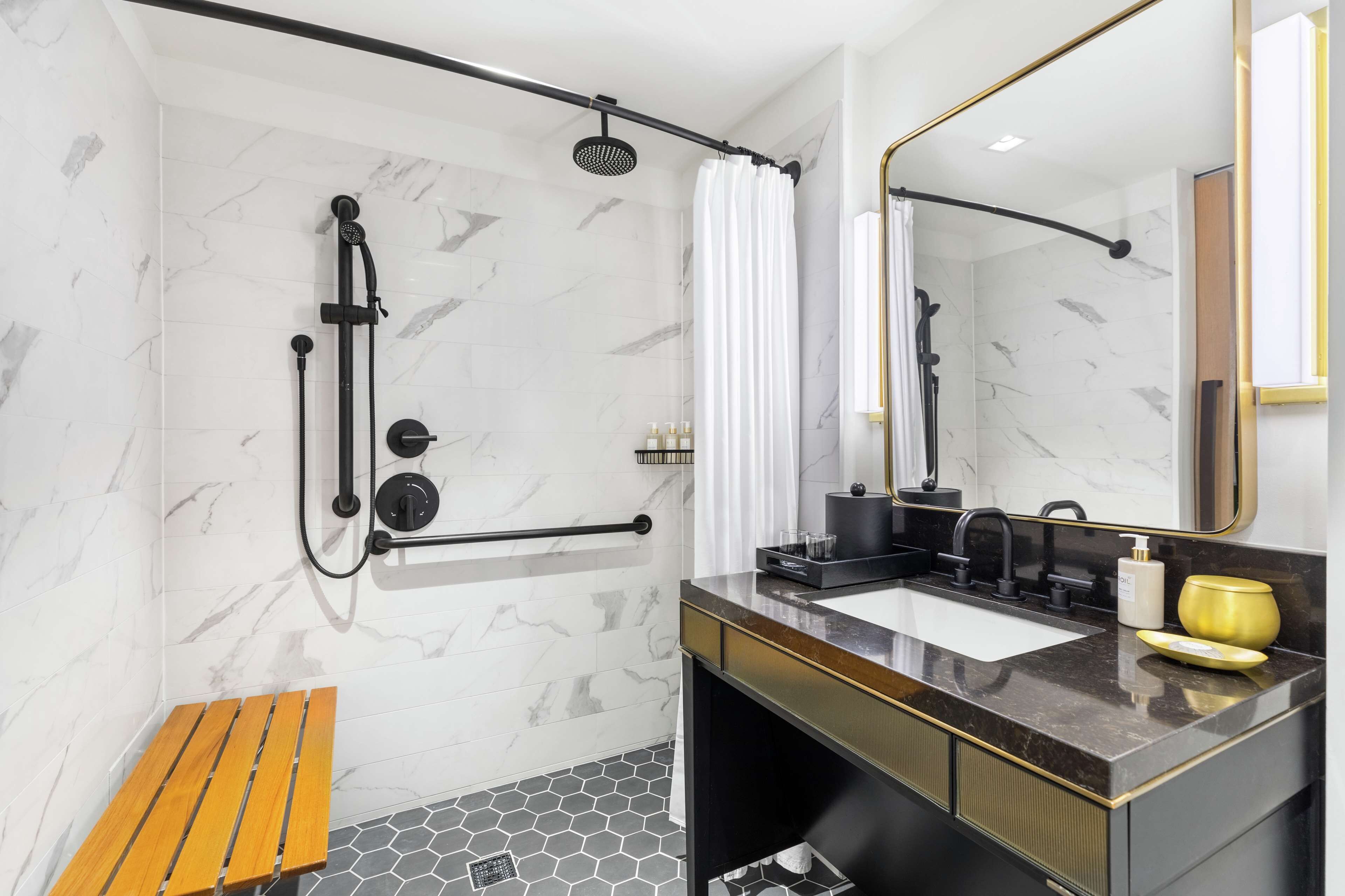 A modern bathroom with a shower, a vanity with a sink, and a mirror.