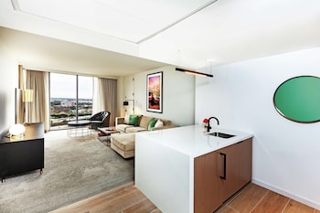 Suite, 1 Bedroom | Living area | 55-inch LCD TV with cable channels, plasma TV, pay movies at C. Baldwin, Curio Collection by Hilton