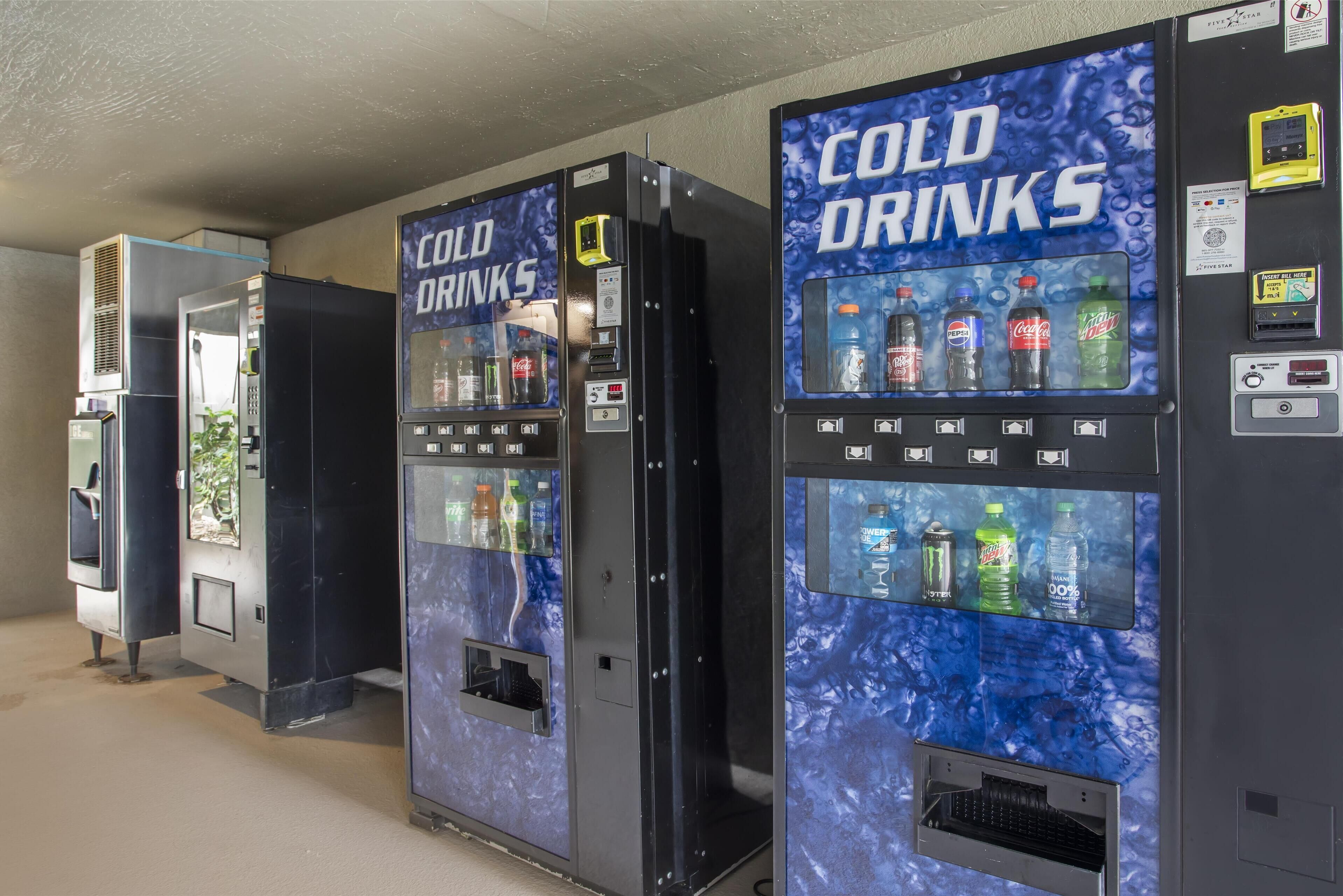 Vending machines labeled "COLD DRINKS" with various beverage options.
