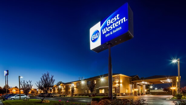 A Best Western Inn & Suites with a large illuminated sign, well-lit exterior, and a parking lot. - Best Western Inn & Suites (Ontario)
