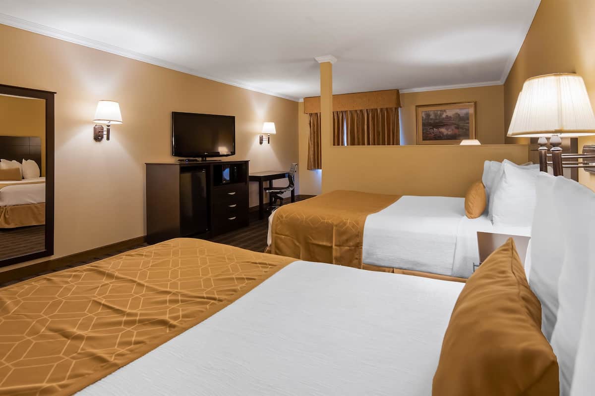 suite, 2 queen beds, non smoking, refrigerator & microwave (with sofabed) | desk, laptop workspace, iron/ironing board, free cots/infant beds