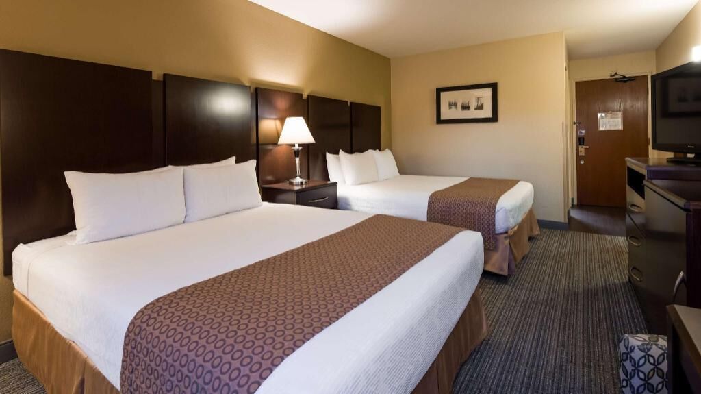 Premium bedding, desk, laptop workspace, iron/ironing board