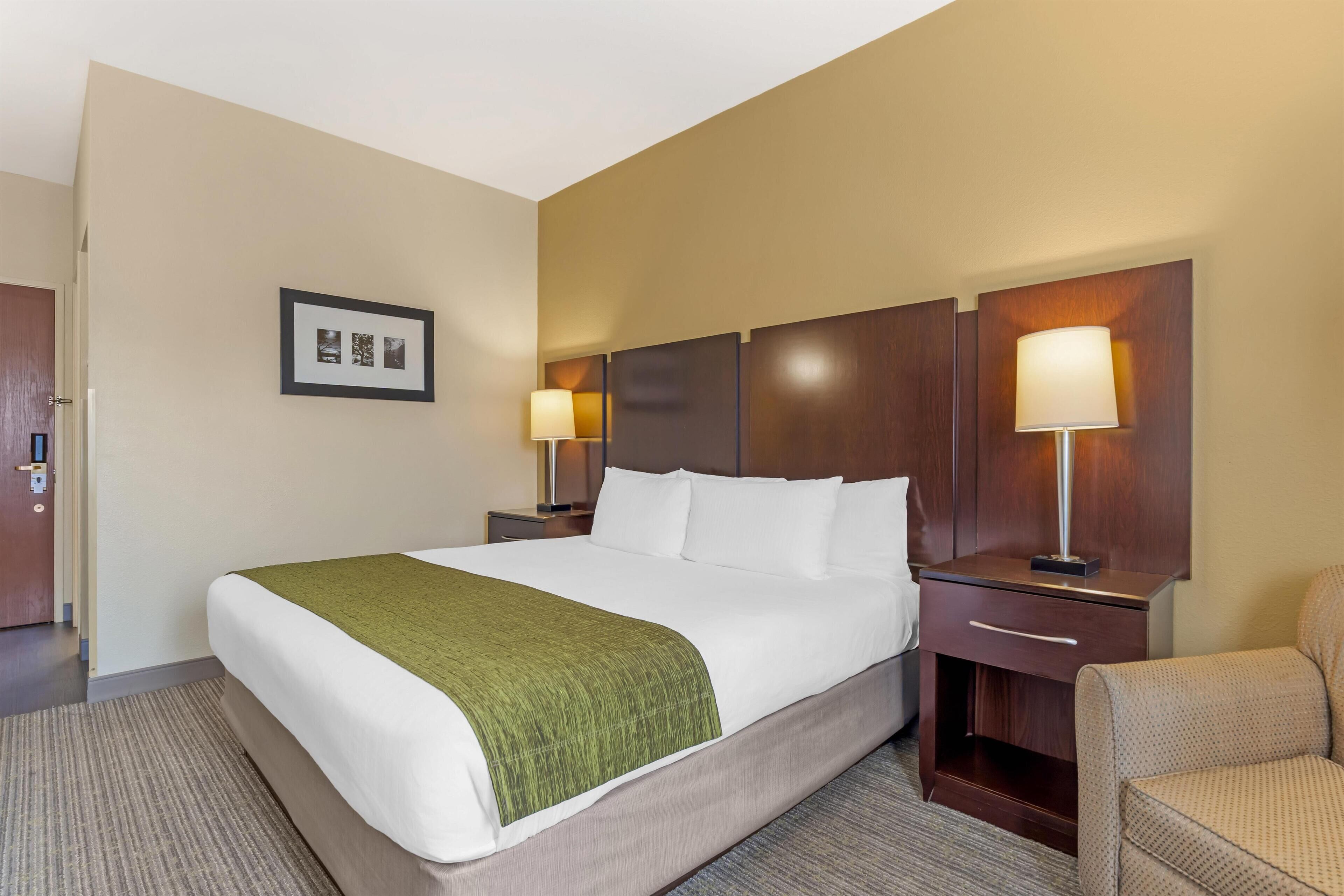 Premium bedding, desk, laptop workspace, iron/ironing board