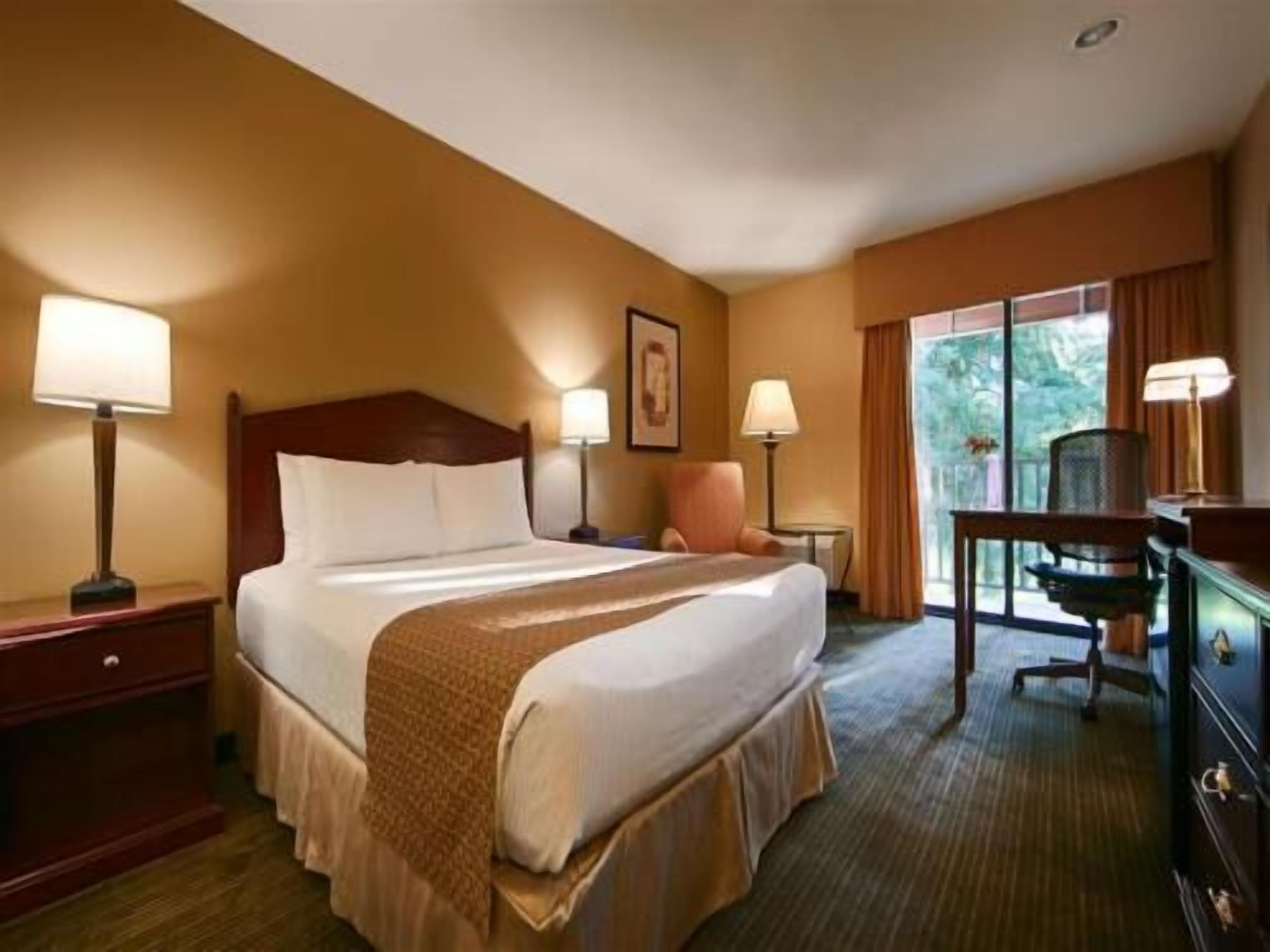 Premium bedding, desk, laptop workspace, iron/ironing board