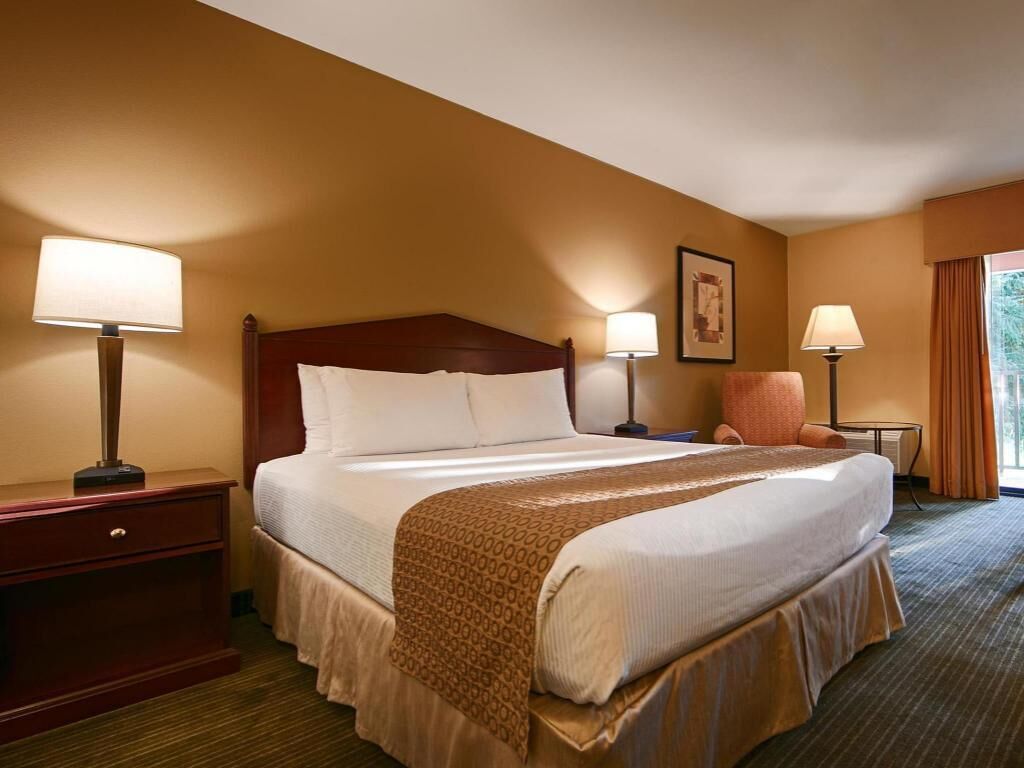 Premium bedding, desk, laptop workspace, iron/ironing board