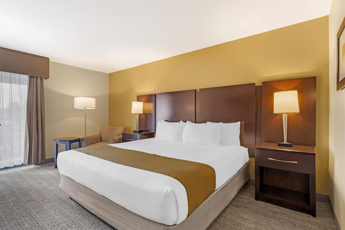 Premium bedding, desk, laptop workspace, iron/ironing board